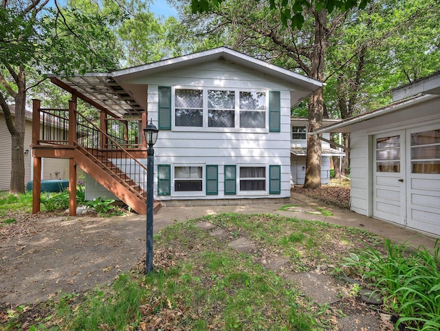 1716 9th Ave SE, Saint Cloud, MN 56304 - view of front of property with stairway and a wooden deck