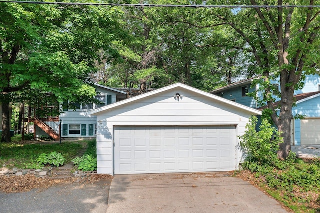 1716 9th Ave SE, Saint Cloud, MN 56304 - view of front facade with a garage and stairs