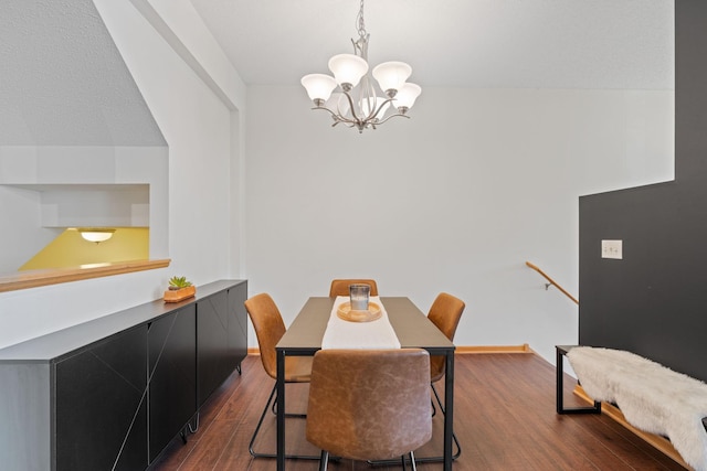 dining area with an inviting chandelier, baseboards, and dark wood-style floors