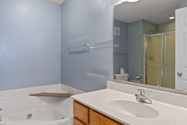 full bathroom with vanity, a textured ceiling, visible vents, a shower stall, and a whirlpool tub