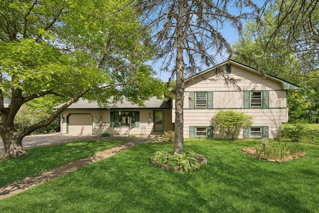 14129 Quay St NW, Andover, MN 55304 - split level home with driveway, a garage, and a front yard