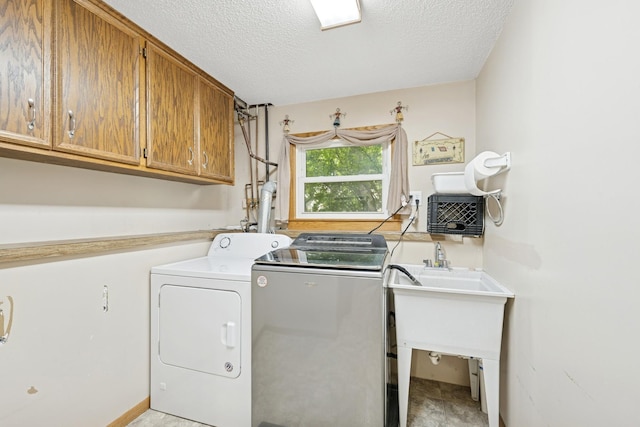 14129 Quay St NW, Andover, MN 55304 - laundry room featuring cabinet space, independent washer and dryer, and a textured ceiling