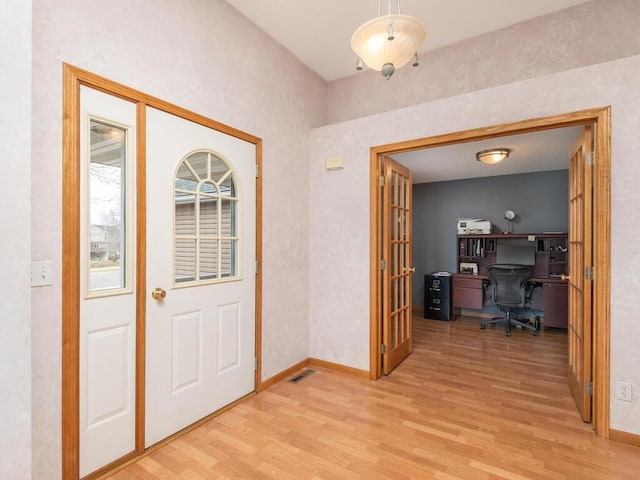 13852 Jasmine Way, Rogers, MN 55374 - entrance foyer with light wood-style floors and baseboards