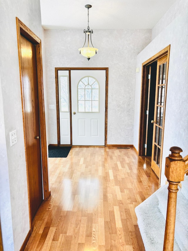 13852 Jasmine Way, Rogers, MN 55374 - foyer entrance featuring light wood-style floors and baseboards