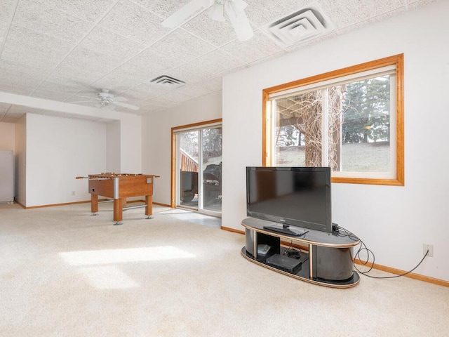 13852 Jasmine Way, Rogers, MN 55374 - carpeted living room featuring a ceiling fan and baseboards