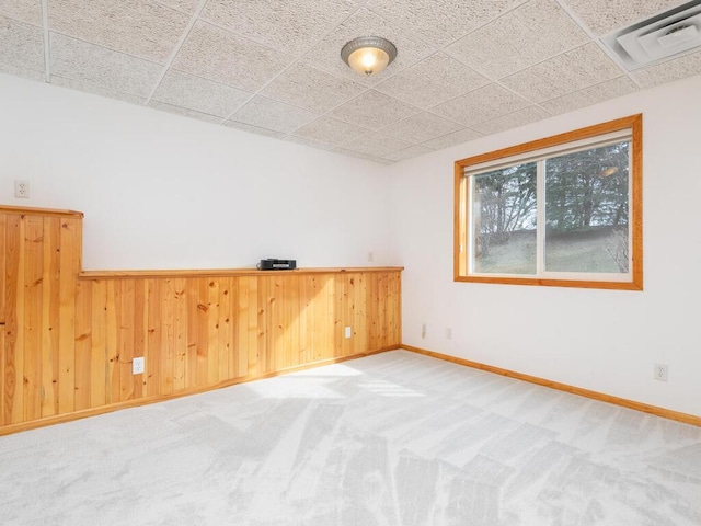 13852 Jasmine Way, Rogers, MN 55374 - carpeted empty room featuring wooden walls, baseboards, and a wainscoted wall