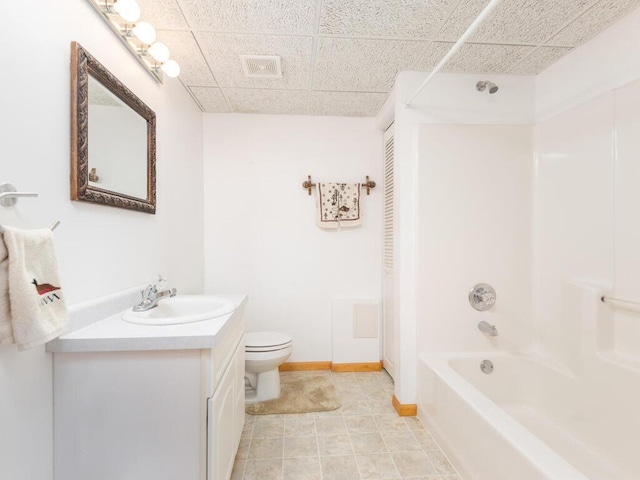 13852 Jasmine Way, Rogers, MN 55374 - full bathroom featuring toilet, shower / bathtub combination, vanity, a paneled ceiling, and baseboards