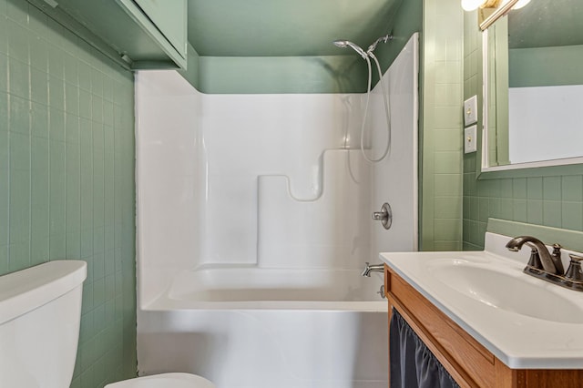 108 Benjamin St, Jackson, MN 56143 - full bathroom featuring tile walls, toilet, bathtub / shower combination, and vanity