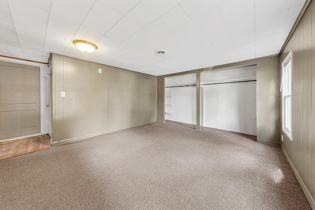 108 Benjamin St, Jackson, MN 56143 - unfurnished bedroom with carpet and two closets