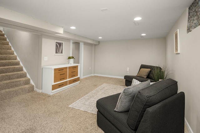living area featuring light carpet, stairs, recessed lighting, and baseboards