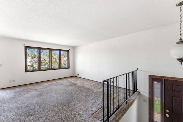 1635 140th St, Burnsville, MN 55337 - empty room with carpet flooring and a textured ceiling
