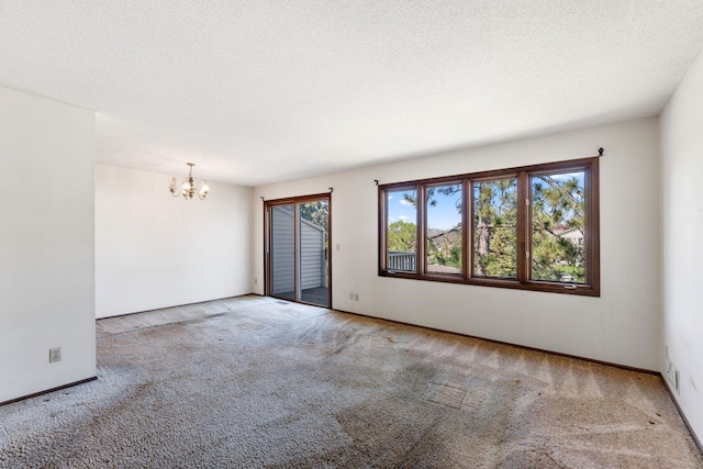 1635 140th St, Burnsville, MN 55337 - unfurnished room with a chandelier, carpet floors, a textured ceiling, and baseboards