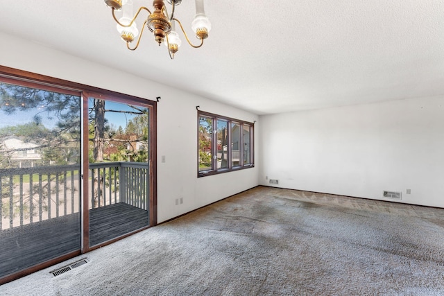 1635 140th St, Burnsville, MN 55337 - empty room with a chandelier, carpet floors, and a textured ceiling