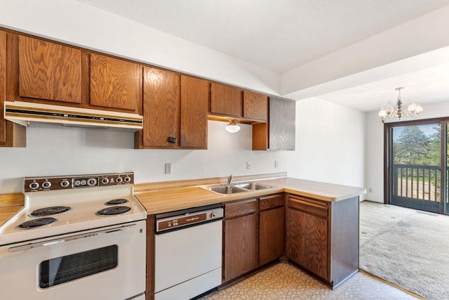 1635 140th St, Burnsville, MN 55337 - kitchen with white appliances, under cabinet range hood, a sink, and light countertops