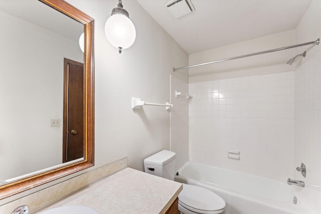 1635 140th St, Burnsville, MN 55337 - bathroom featuring vanity, toilet, and tub / shower combination