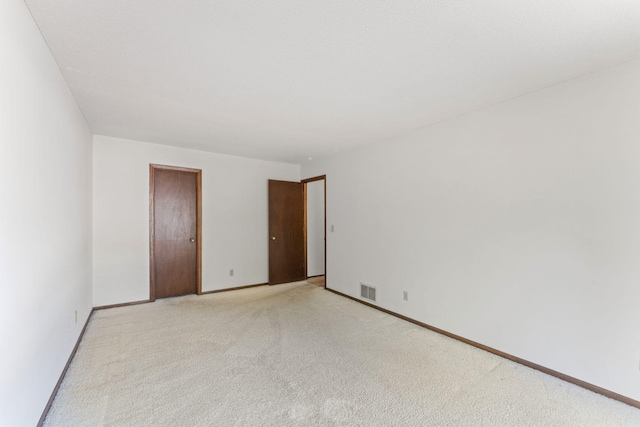 1635 140th St, Burnsville, MN 55337 - unfurnished room with light carpet and baseboards