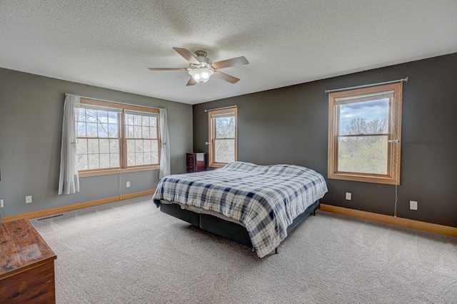 347 Glover Rd, Troy Twp, WI 54022 - bedroom featuring baseboards, a textured ceiling, ceiling fan, and carpet floors