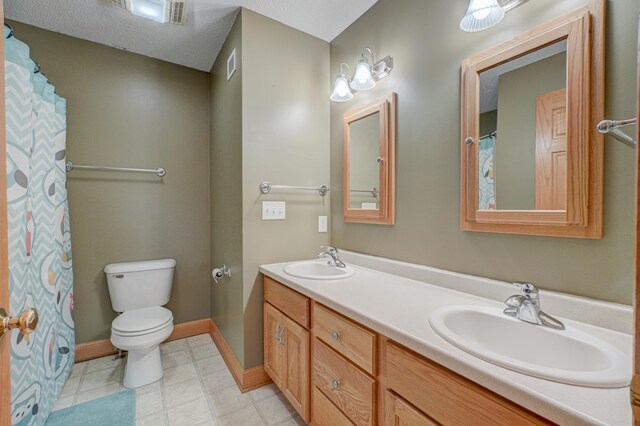 347 Glover Rd, Troy Twp, WI 54022 - full bath with toilet, visible vents, baseboards, and a sink