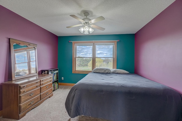 347 Glover Rd, Troy Twp, WI 54022 - bedroom featuring ceiling fan, light carpet, a textured ceiling, and multiple windows