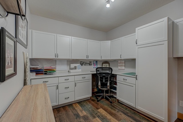 347 Glover Rd, Troy Twp, WI 54022 - home office with built in desk and dark wood-style flooring