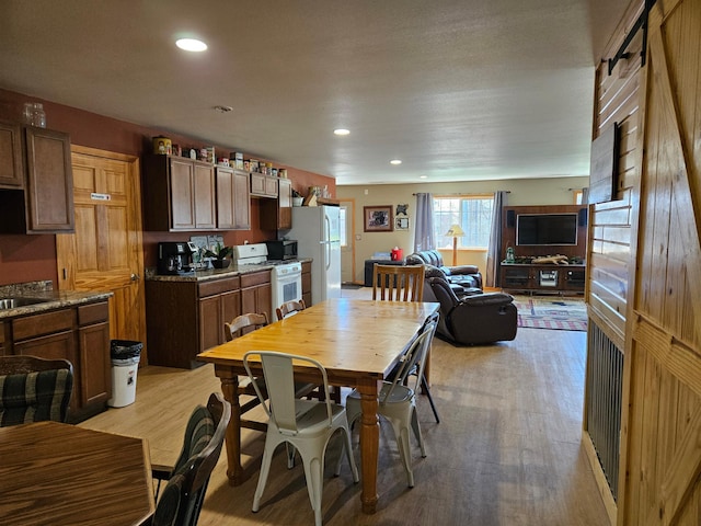 36282 Rush Lake Loop Unit 29A, Ottertail, MN 56571 - dining room featuring light wood-type flooring and recessed lighting