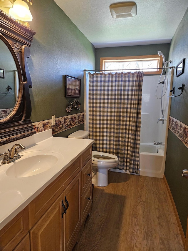 36282 Rush Lake Loop Unit 29A, Ottertail, MN 56571 - full bath with wood finished floors, toilet, a textured ceiling, shower / bath combo, and vanity