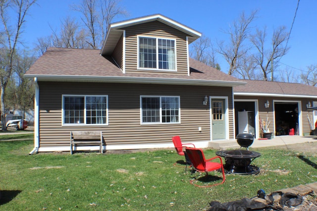 36282 Rush Lake Loop Unit 29A, Ottertail, MN 56571 - rear view of house with a yard, a fire pit, and a shingled roof