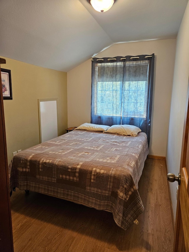 36282 Rush Lake Loop Unit 29A, Ottertail, MN 56571 - bedroom with wood finished floors and lofted ceiling