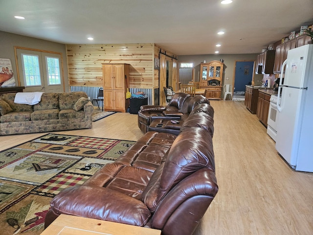 36282 Rush Lake Loop Unit 29A, Ottertail, MN 56571 - living area with light wood-style flooring, recessed lighting, and wooden walls