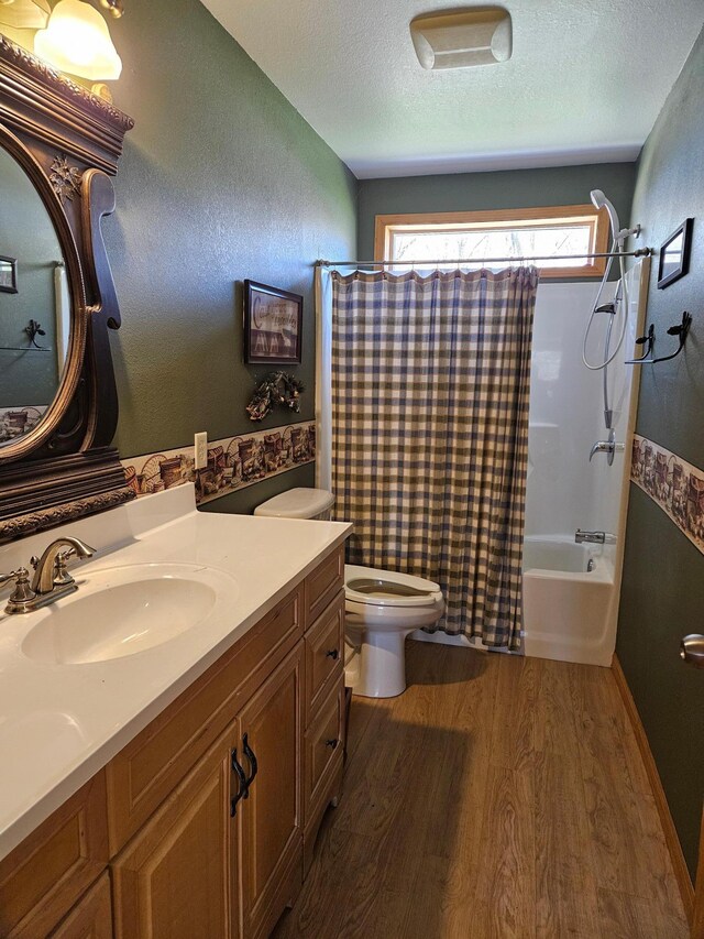 36282 Rush Lake Loop Unit 29A, Ottertail, MN 56571 - full bath featuring wood finished floors, shower / bathtub combination with curtain, toilet, vanity, and a textured ceiling