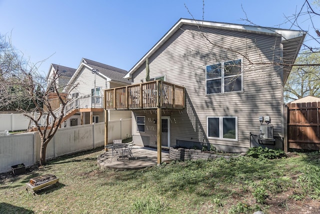 back of property with cooling unit, a patio, and a deck