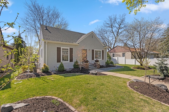 bungalow-style house featuring a front yard, stucco siding, roof with shingles, and fence
