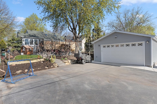 view of front of home featuring an outdoor structure and a detached garage