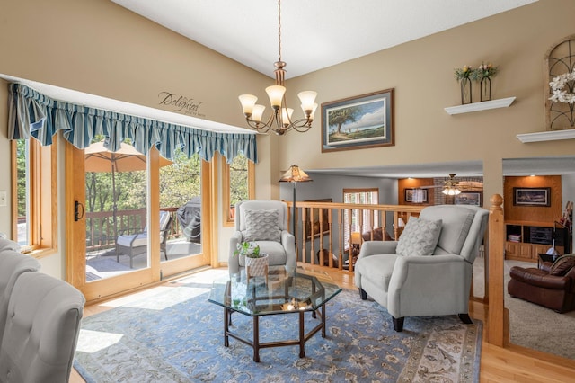 1282 141st Ln NW, Andover, MN 55304 - living room featuring wood finished floors, a chandelier, and ceiling fan