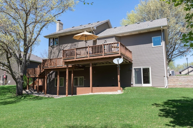 1282 141st Ln NW, Andover, MN 55304 - rear view of house with a deck, a lawn, and a chimney