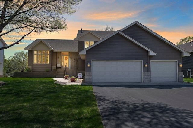 1282 141st Ln NW, Andover, MN 55304 - view of front facade with a garage, asphalt driveway, and a front lawn