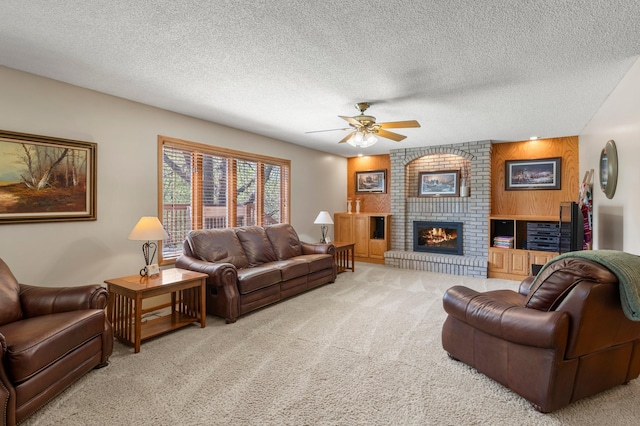 1282 141st Ln NW, Andover, MN 55304 - living room featuring light colored carpet, ceiling fan, a brick fireplace, and a textured ceiling