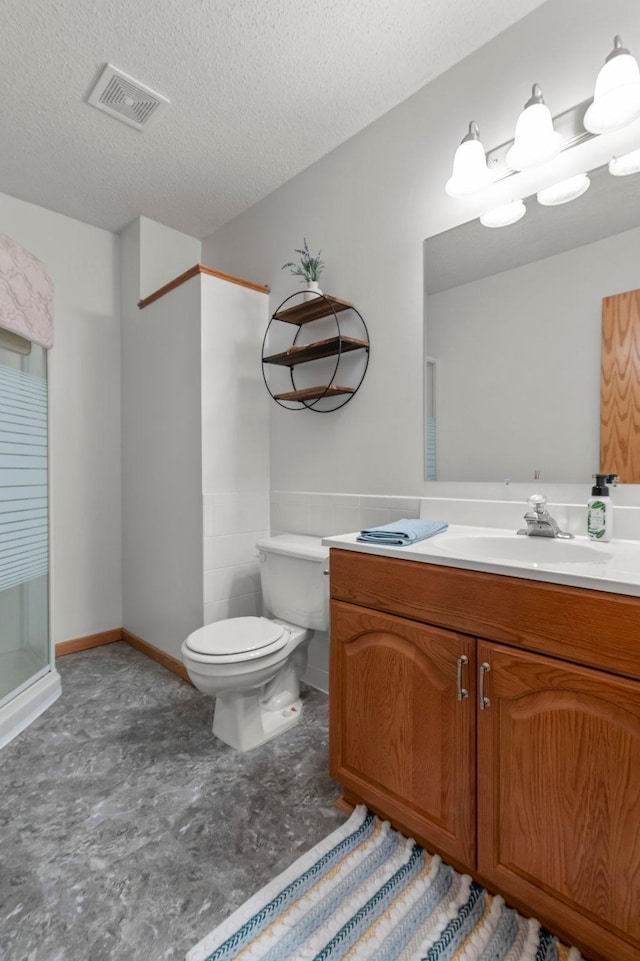 1282 141st Ln NW, Andover, MN 55304 - bathroom with vanity, a textured ceiling, and a shower