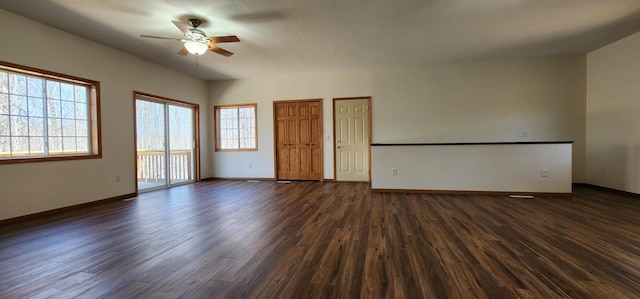 empty room with dark wood finished floors, baseboards, and ceiling fan