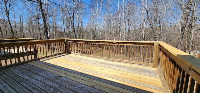 deck featuring a view of trees
