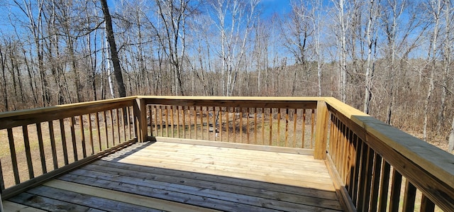 wooden terrace with a forest view