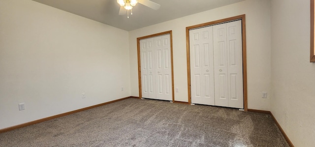 unfurnished bedroom featuring ceiling fan, carpet, baseboards, and multiple closets