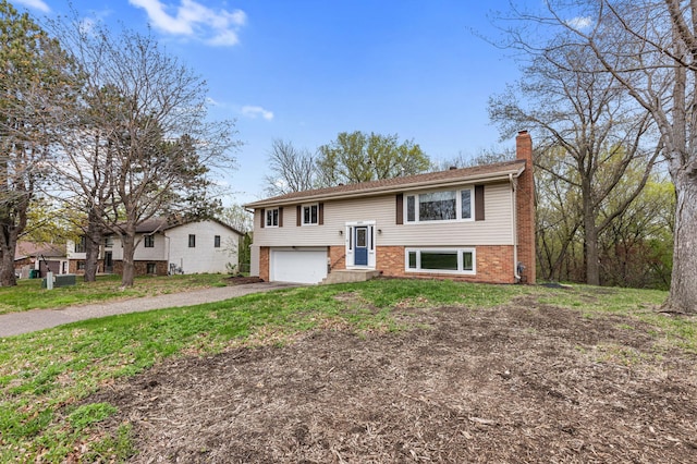 2409 Highland View Ave S, Burnsville, MN 55337 - raised ranch with a chimney, an attached garage, driveway, and brick siding