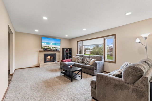 2409 Highland View Ave S, Burnsville, MN 55337 - living area with recessed lighting, a fireplace, baseboards, and carpet