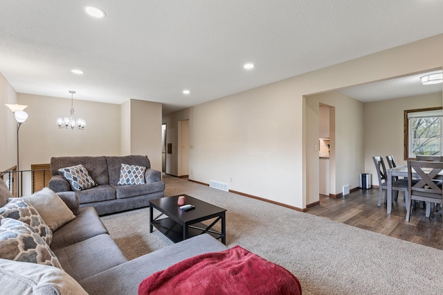2409 Highland View Ave S, Burnsville, MN 55337 - living area featuring carpet floors, a chandelier, recessed lighting, and baseboards