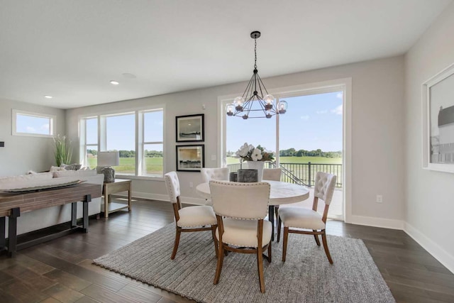 10833 38th Trl N, Lake Elmo, MN 55042 - dining space with baseboards, recessed lighting, a chandelier, and dark wood-style floors