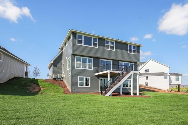 10833 38th Trl N, Lake Elmo, MN 55042 - rear view of property with stairway, a deck, and a lawn