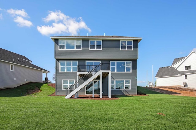 10833 38th Trl N, Lake Elmo, MN 55042 - rear view of house with stairway, a lawn, and a deck