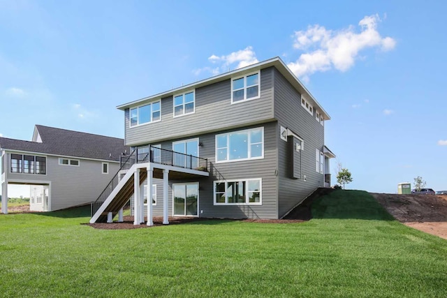 10833 38th Trl N, Lake Elmo, MN 55042 - back of property featuring stairway, a lawn, and a wooden deck