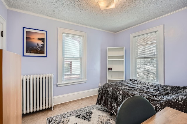 bedroom with ornamental molding, carpet flooring, and radiator heating unit